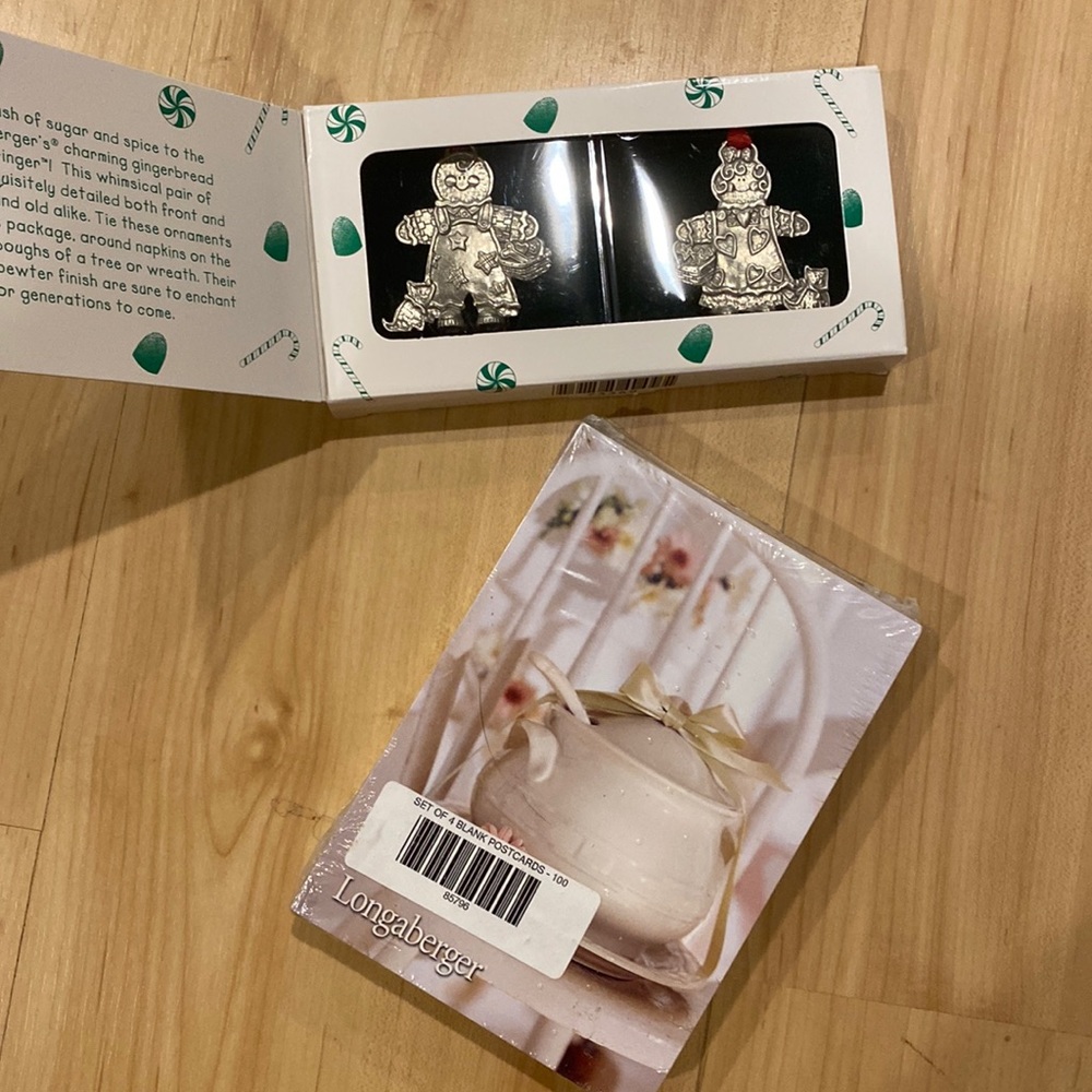 Longaberger Roger and Ginger ornaments and 100 black Longaberger postcards.